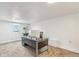 Functional office space with a large desk, comfortable seating, and a bright window at 3595 W 67Th S Ave, Denver, CO 80221
