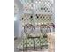 Secluded patio area featuring metal chairs and a partial privacy trellis fence at 3595 W 67Th S Ave, Denver, CO 80221