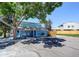 Charming blue clubhouse near parking with a large tree providing ample shade at 7973 Chase Circle # 54, Arvada, CO 80003