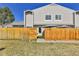 Townhouse front exterior featuring a yard with a privacy fence at 7973 Chase Circle # 54, Arvada, CO 80003