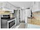 Modern kitchen with stainless steel appliances and granite countertops at 7973 Chase Circle # 54, Arvada, CO 80003
