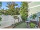 Small backyard with white fence and a bird bath, perfect for a small garden at 5843 Ceylon St, Denver, CO 80249