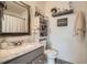 Stylishly renovated bathroom featuring vanity with granite countertop and modern fixtures at 5843 Ceylon St, Denver, CO 80249