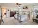 Cozy bedroom with soft carpet, a decorative accent wall, and barn door closet at 5843 Ceylon St, Denver, CO 80249