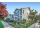 Charming townhouse exterior with well-maintained landscaping and blue siding at 5843 Ceylon St, Denver, CO 80249