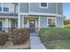 Charming townhome exterior featuring a well-manicured lawn, tasteful landscaping, and a welcoming front door at 5843 Ceylon St, Denver, CO 80249