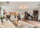 Spacious living room with hardwood floors and an open view to the kitchen at 5843 Ceylon St, Denver, CO 80249