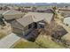 Aerial shot featuring a well-manicured lawn, a two-car garage, and a beautiful home exterior at 4561 Hope Cir, Broomfield, CO 80023