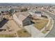 Lovely single-story home with an attached garage, driveway, and simple front yard landscape at 4561 Hope Cir, Broomfield, CO 80023