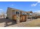 Back of house featuring back deck with a stone pillar detail and fencing at 4561 Hope Cir, Broomfield, CO 80023