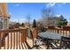 Back deck with a table and chairs, and a beautiful view of the surrounding neighborhood at 4561 Hope Cir, Broomfield, CO 80023