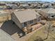 Aerial view of backyard with patio/deck with outdoor seating and a simple, xeriscaped design at 4561 Hope Cir, Broomfield, CO 80023