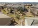 Aerial view of simple backyard with patio/deck with outdoor seating and a small, xeriscaped space at 4561 Hope Cir, Broomfield, CO 80023