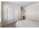 Bedroom with neutral color and sliding door closet with easy access to the rest of the home at 4561 Hope Cir, Broomfield, CO 80023