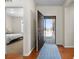 Inviting entryway with hardwood floors, a patterned rug, and bedroom view at 4561 Hope Cir, Broomfield, CO 80023