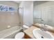 Clean bathroom with a bathtub, toilet and sink at 2020 Alpine Dr, Erie, CO 80516