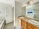 Double vanity bathroom with large mirror and lake view at 2020 Alpine Dr, Erie, CO 80516