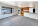 Kitchen with island, hardwood floor and view to outside at 2020 Alpine Dr, Erie, CO 80516