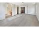 Large main bedroom with carpet and access to the bathroom and hallway at 2020 Alpine Dr, Erie, CO 80516