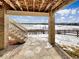 Stone patio with stairs and view of a snowy landscape at 2020 Alpine Dr, Erie, CO 80516