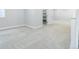 Open finished basement area features neutral carpet and access to a storage closet at 4858 S Tibet St, Aurora, CO 80015