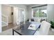 Bright home office with a large window, stylish decor, and comfortable seating at 4858 S Tibet St, Aurora, CO 80015
