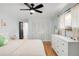 Comfortable bedroom featuring hardwood floors, a ceiling fan, and a double door closet at 4585 Hooker St, Denver, CO 80211
