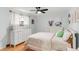 Cozy bedroom with hardwood floors, a ceiling fan, and a double door closet at 4585 Hooker St, Denver, CO 80211