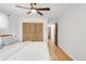 Bright bedroom features a ceiling fan, wood floors, closet with louvered doors and natural light at 4585 Hooker St, Denver, CO 80211