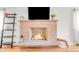 Stylish brick fireplace with a mantel, logs, and decorative accents, creating a cozy focal point at 4585 Hooker St, Denver, CO 80211