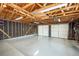 Spacious three car garage with an epoxy floor and insulated doors and exposed ceiling at 4585 Hooker St, Denver, CO 80211