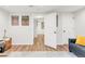 Hallway view showing doors, luxury vinyl plank flooring and updated decor at 4585 Hooker St, Denver, CO 80211