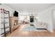 Cozy living room featuring a brick fireplace, hardwood floors, and a comfortable seating arrangement at 4585 Hooker St, Denver, CO 80211