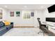 Well-lit office space with modern decor, and a comfortable seating area with luxury vinyl plank flooring at 4585 Hooker St, Denver, CO 80211