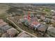 Aerial view of a home in a neighborhood, highlighting its landscaped yard and proximity to green spaces at 9724 Cantabria Pt, Lone Tree, CO 80124