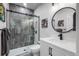 Updated bathroom features modern finishes, glass shower and sleek fixtures at 9724 Cantabria Pt, Lone Tree, CO 80124