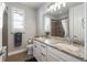 Bathroom with granite countertop, dual vanity, and shower at 9724 Cantabria Pt, Lone Tree, CO 80124