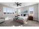 Serene bedroom with ample natural light, neutral tones, and comfortable furnishings at 9724 Cantabria Pt, Lone Tree, CO 80124