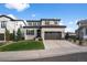 Charming two-story home with a well-manicured lawn and a two-car garage at 9724 Cantabria Pt, Lone Tree, CO 80124