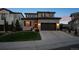 Beautifully landscaped two-story home with a two-car garage and inviting curb appeal at 9724 Cantabria Pt, Lone Tree, CO 80124