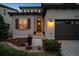 Inviting front entrance with elegant landscaping and a charming front door at 9724 Cantabria Pt, Lone Tree, CO 80124