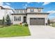 Charming two-story home with a well-manicured lawn and a two-car garage at 9724 Cantabria Pt, Lone Tree, CO 80124
