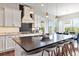 Spacious kitchen with island, modern appliances, and adjacent dining area with plenty of light at 9724 Cantabria Pt, Lone Tree, CO 80124