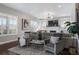 Spacious living room with neutral decor, fireplace, large sectional sofa and plenty of windows at 9724 Cantabria Pt, Lone Tree, CO 80124