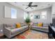 Cozy living room with couches and lots of natural light at 9724 Cantabria Pt, Lone Tree, CO 80124