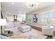 Spacious living room with a modern fireplace, gray sofas, and easy access to the kitchen at 9724 Cantabria Pt, Lone Tree, CO 80124