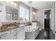 Luxurious main bathroom features a soaking tub, dual vanities, and a separate glass shower at 9724 Cantabria Pt, Lone Tree, CO 80124