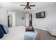 Relaxing main bedroom with ceiling fan, TV, and beverage service at 9724 Cantabria Pt, Lone Tree, CO 80124