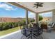 Relaxing outdoor patio with views of the landscaped backyard, perfect for dining and entertaining guests at 9724 Cantabria Pt, Lone Tree, CO 80124