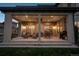Covered outdoor patio featuring comfortable seating, dining area, and grill, ideal for entertaining guests at 9724 Cantabria Pt, Lone Tree, CO 80124